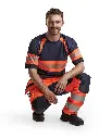 155218115389_Hivis_Pocketbroek_Oranje_Marine_Presentatie_Gehurkt.webp